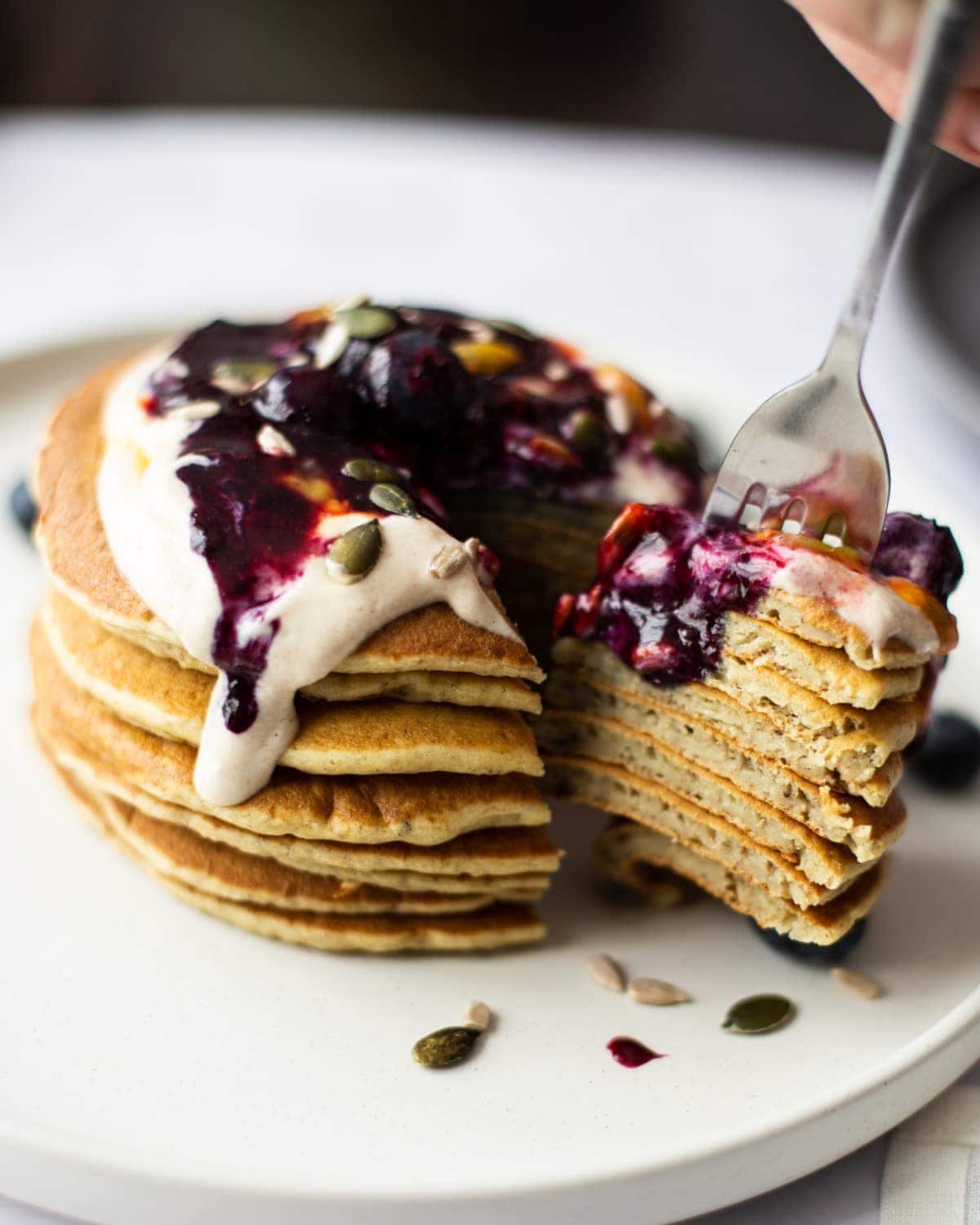 Stacked pancakes, sliced to show the texture of them inside.
