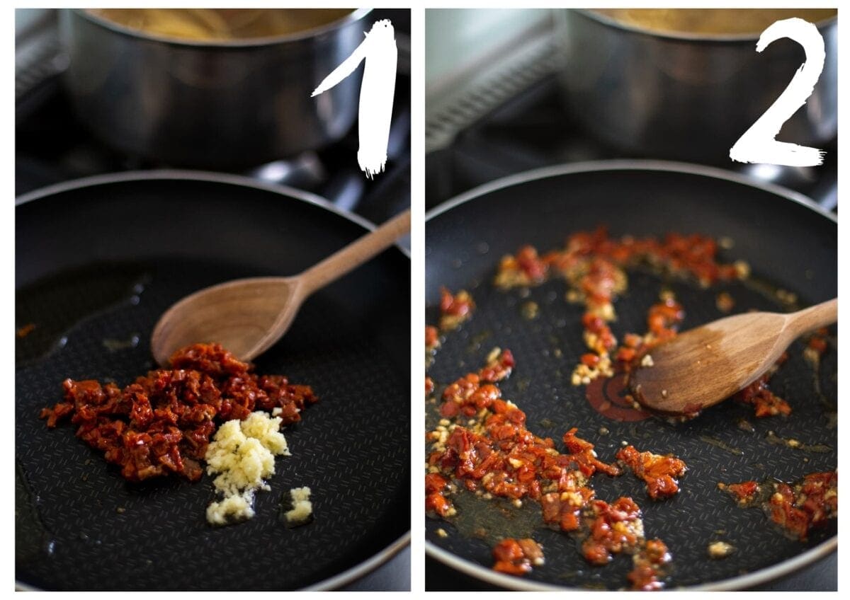 Sun-dried tomato and crushed garlic being stirred together in a frying pan.