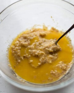 The melted butter being added to the mixture.