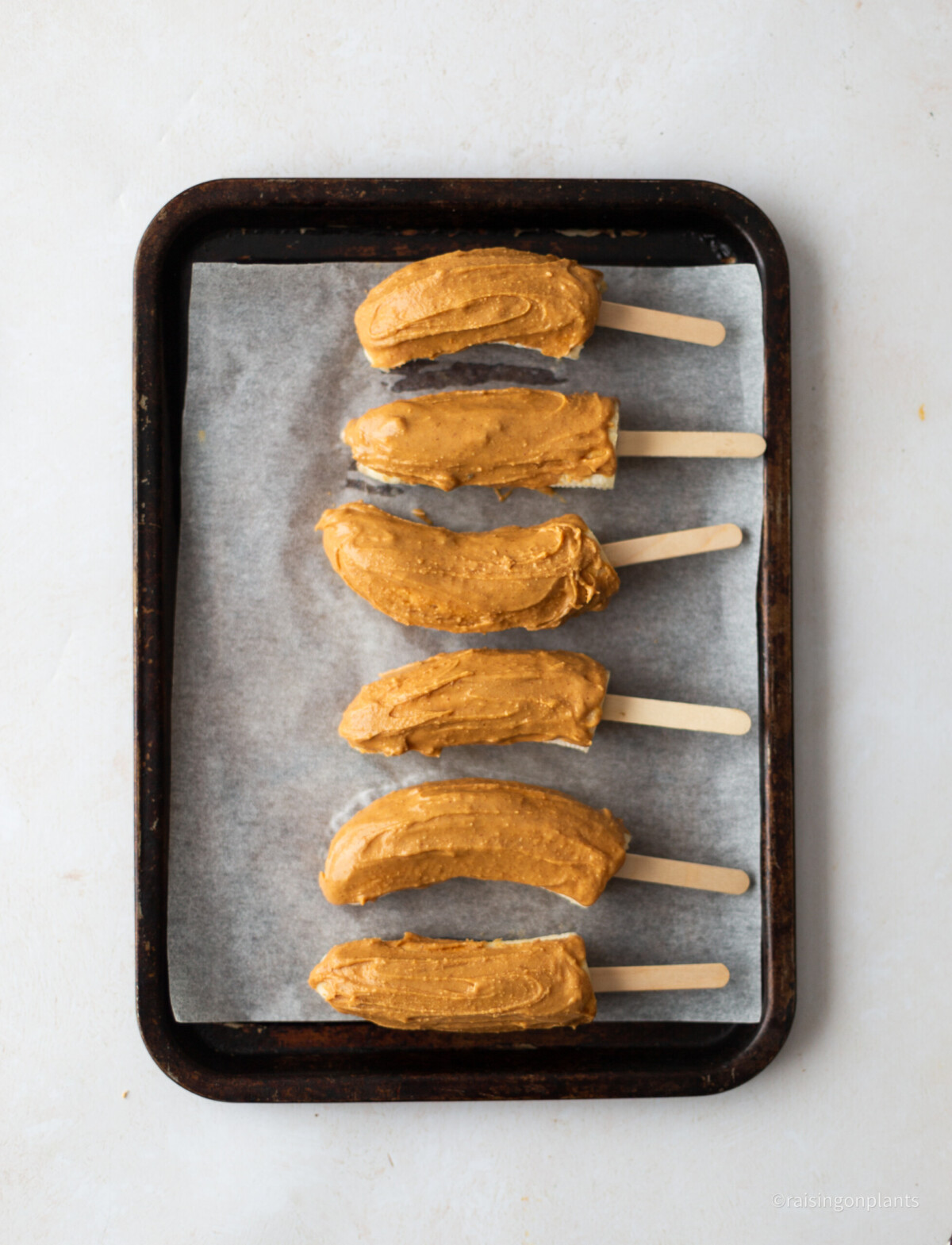 Banana lollies coated in peanut butter. 